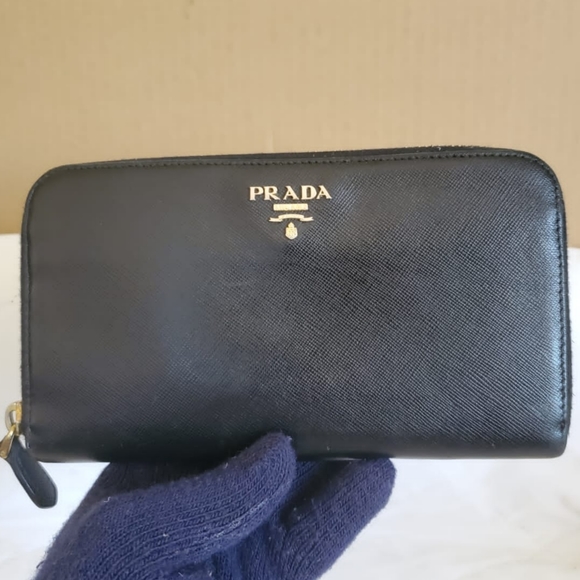 Prada Handbags - PRADA Black Saffiano Zippy Leathe Wallet 